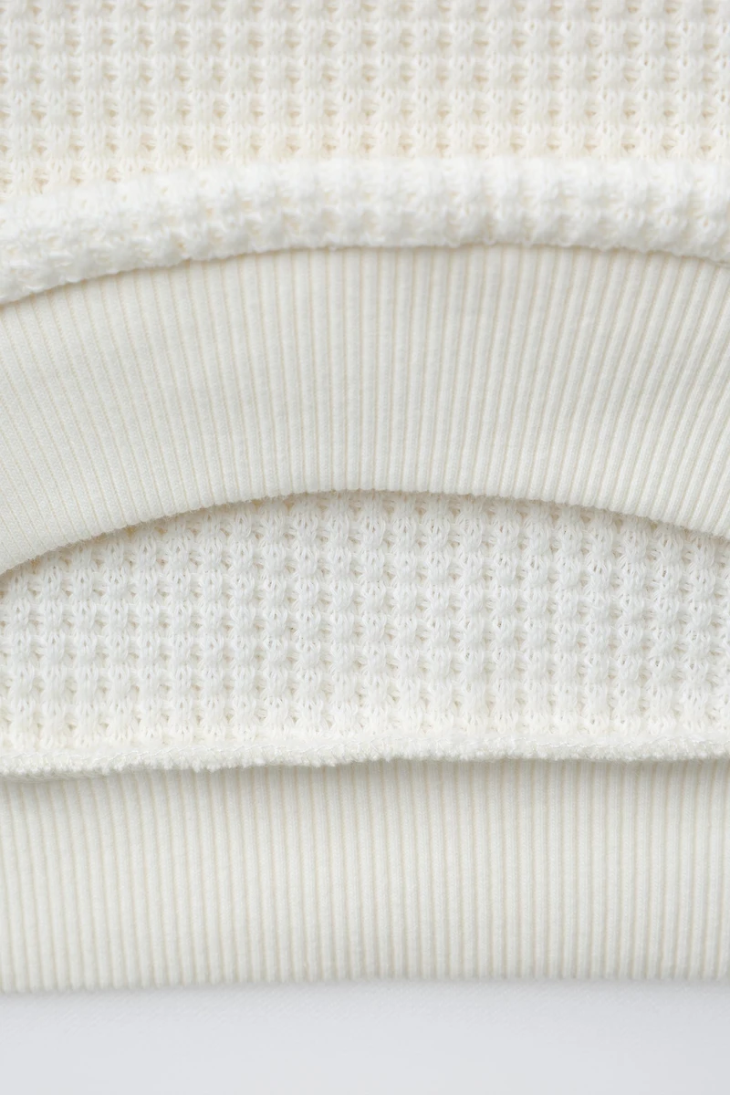 EMBROIDERED WAFFLE SWEATER