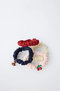 LOT DE QUATRE CHOUCHOUS CHARMS