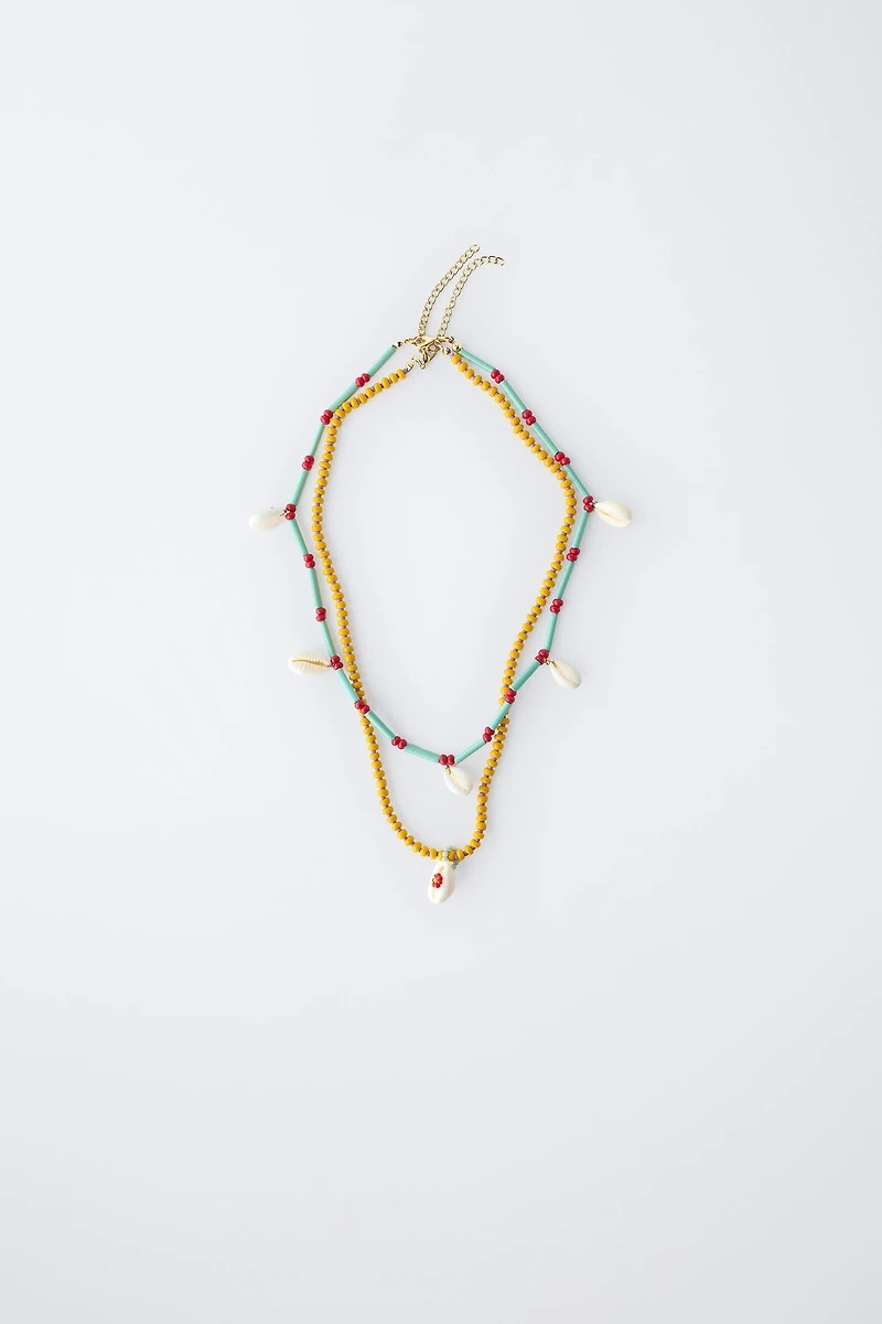 PACK OF TWO BEADED SHELL NECKLACES