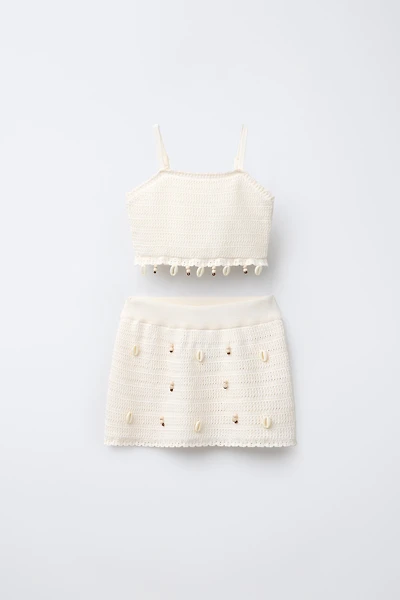 ENSEMBLE TOP ET JUPE EN MAILLE AVEC COQUILLAGES