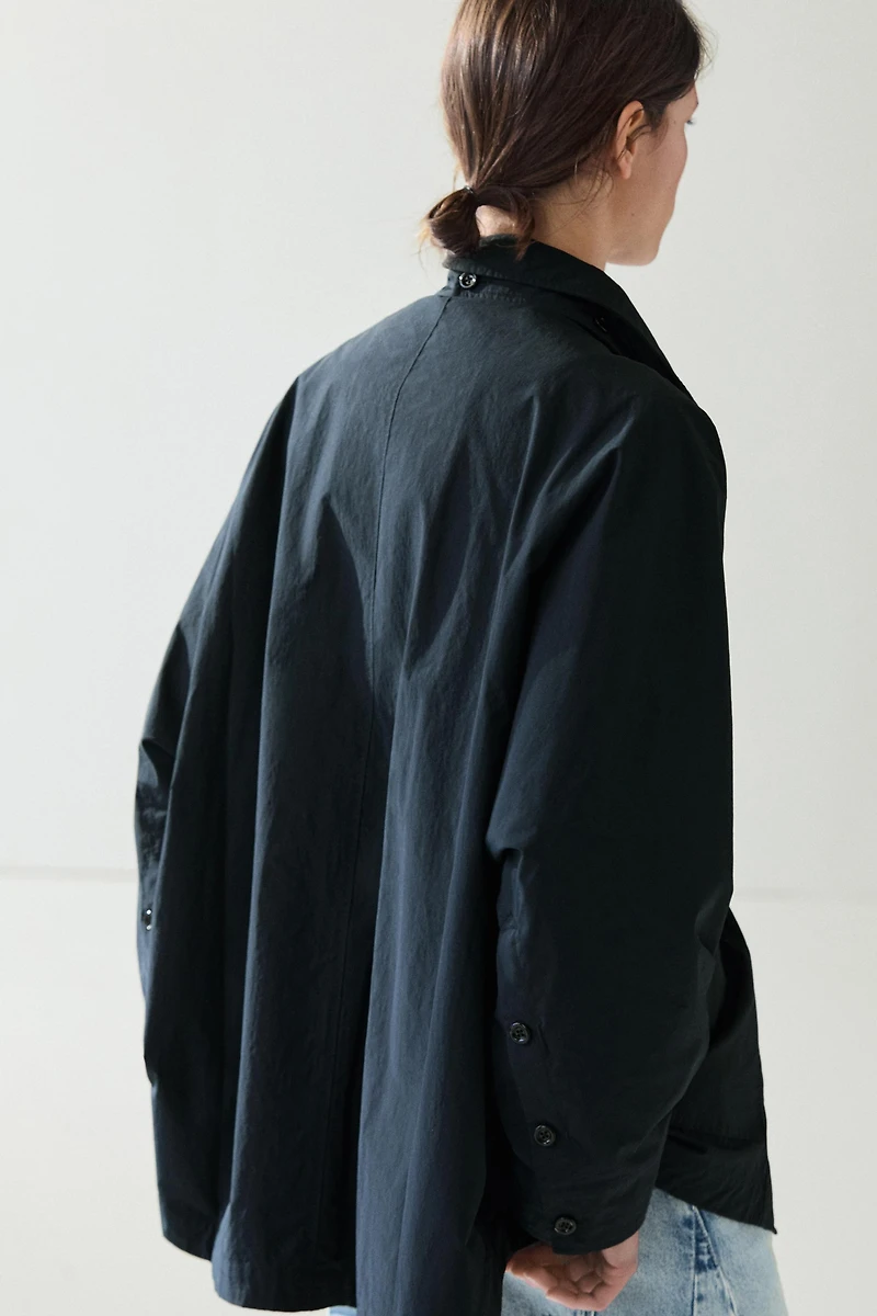 Jacket with buttoned collar strap