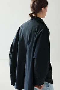 Jacket with buttoned collar strap