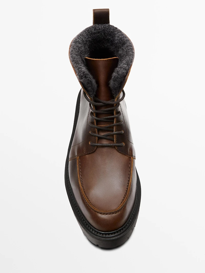 Lace-up leather boots with lined interior