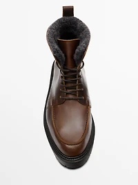 Lace-up leather boots with lined interior