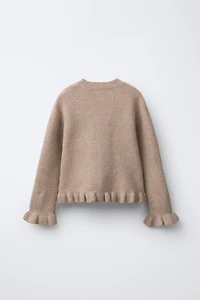 PULL EN MAILLE À VOLANTS