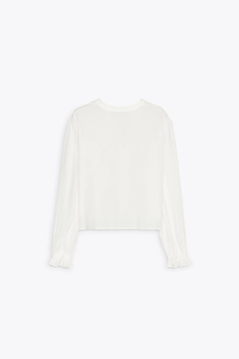 BLOUSE COURTE BRODÉE PERFORÉE