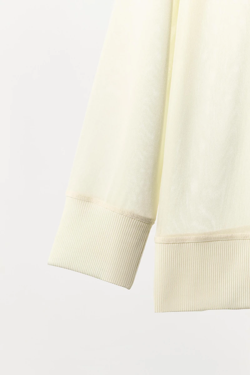 SEMI-SHEER FLOWY SWEATSHIRT
