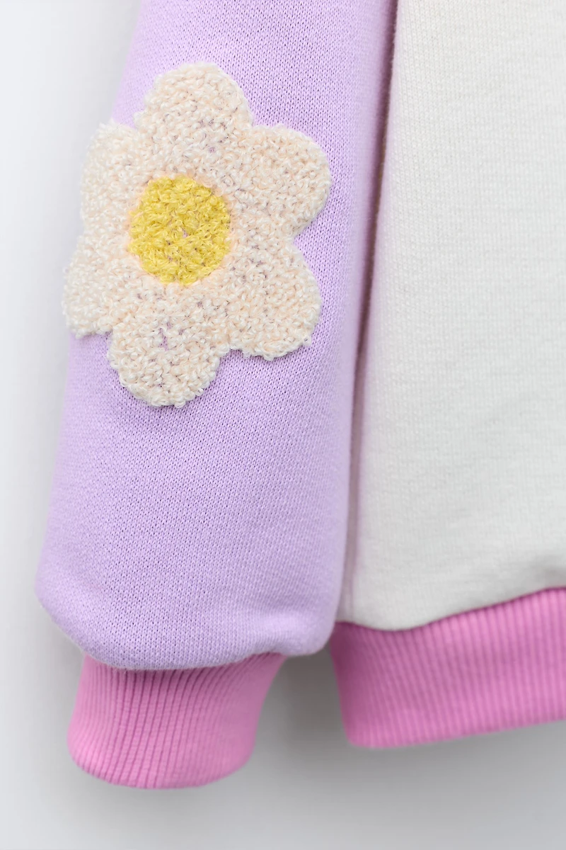 CONTRASTING SLEEVE FLORAL SWEATSHIRT