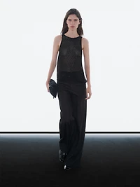 Top semi-transparent à perles fantaisie ton sur