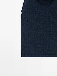 Knit top with draped neckline