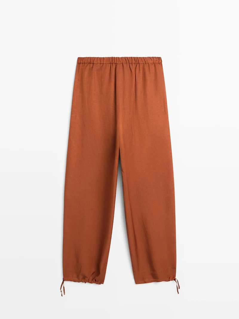 Flowing trousers with tie detail