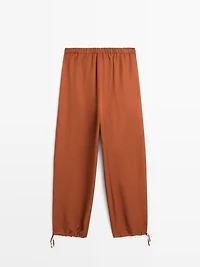 Flowing trousers with tie detail
