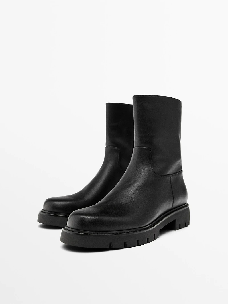 Track sole flat ankle boots