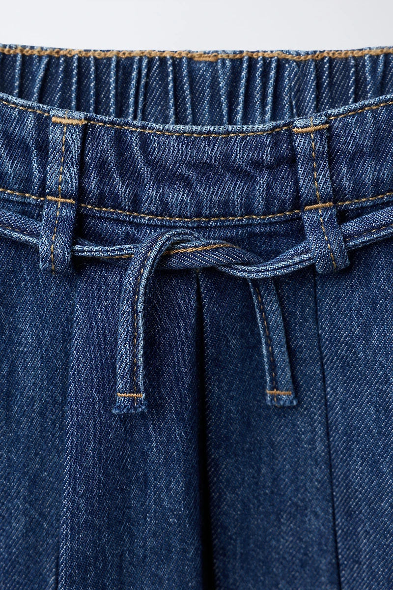 PLEATED DENIM SKIRT