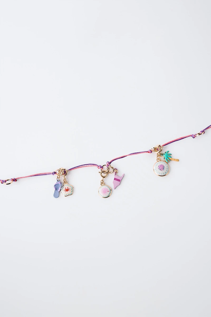INTERCHANGEABLE MULTI-CHARM NECKLACE