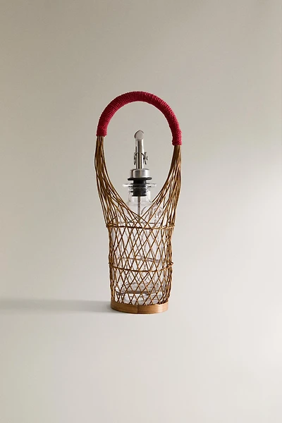 GLASS CRUET WITH RATTAN BASKET