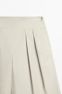 Wide-leg pants with pleated sash detail