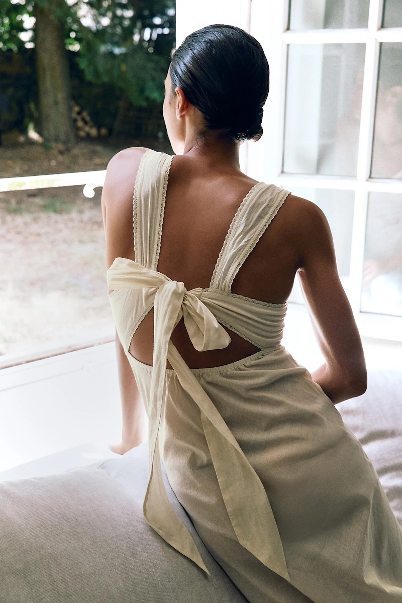 DRESS WITH EMBROIDERY, TEXT, AND BEADING