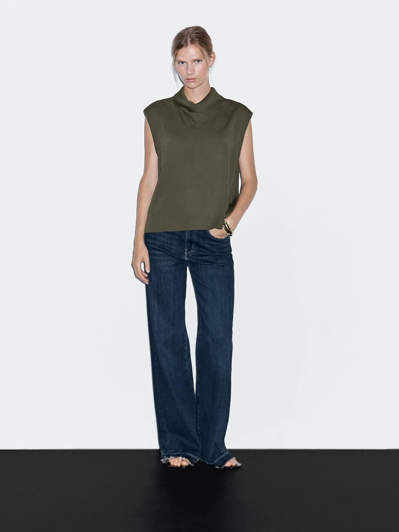 Flowing blouse with draped neck detail