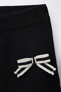 JUPE EN MAILLE AVEC LACETS