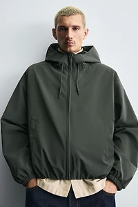 VESTE TECHNIQUE À CAPUCHE
