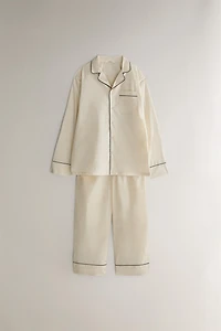 PANTS WITH BLACK PIPING