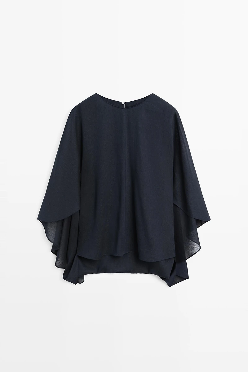 Asymmetric flowing cape