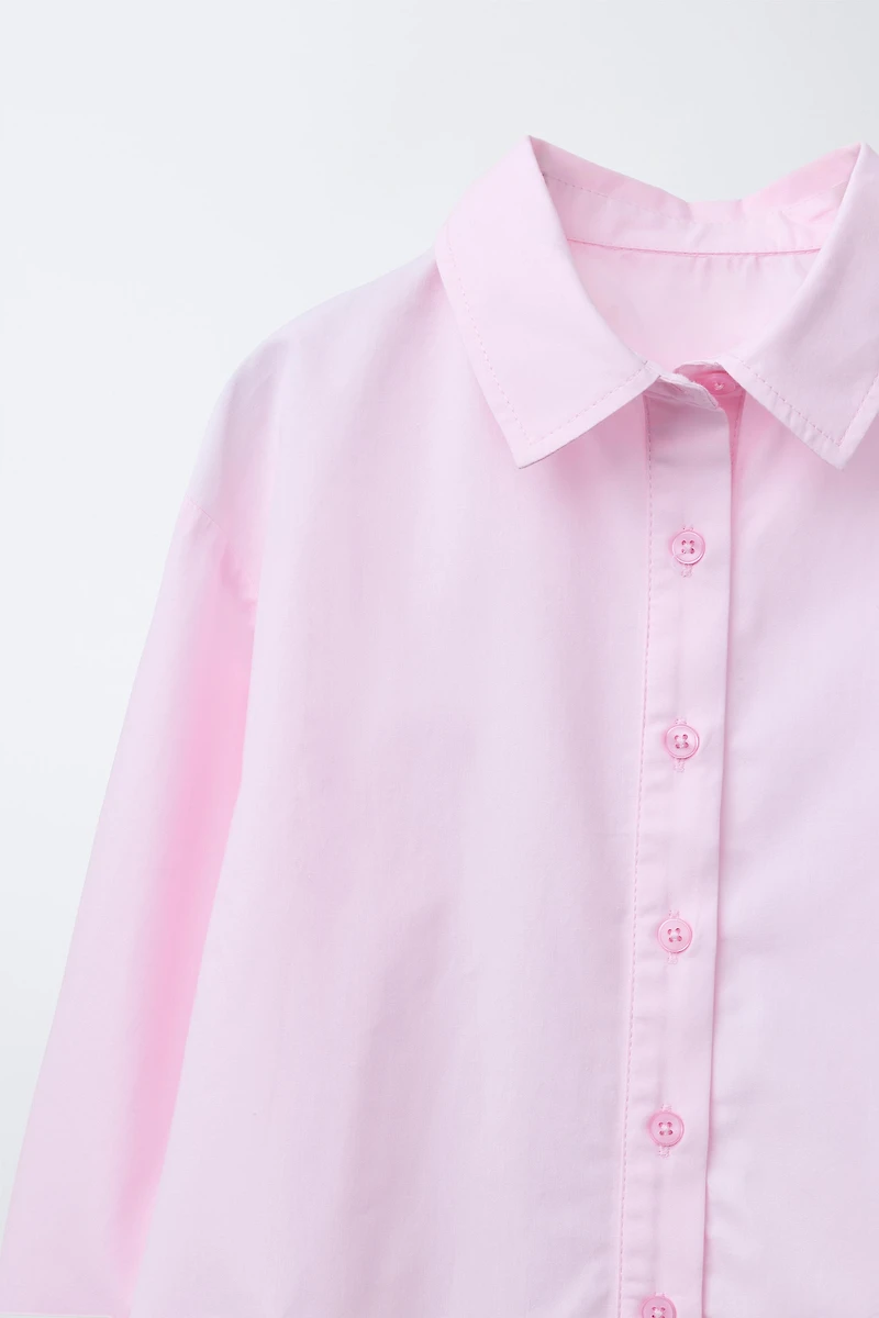 RUFFLED HEM SHIRT