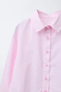 RUFFLED HEM SHIRT