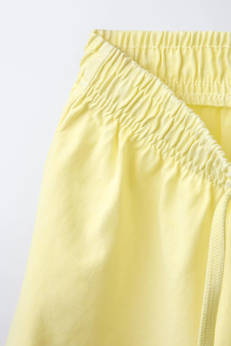 ENSEMBLE T-SHIRT ET BERMUDA TEINT EN PIÈCE