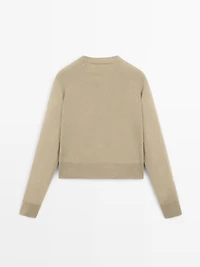 Short knit cardigan with raglan sleeves