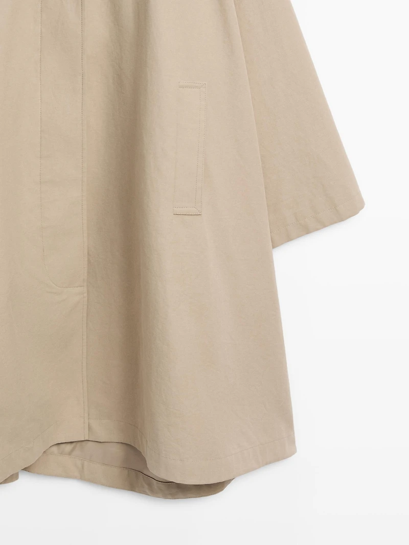 Cape trench coat with hood