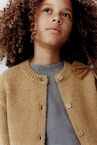 GILET EN MAILLE AVEC NOEUD ORGANZA