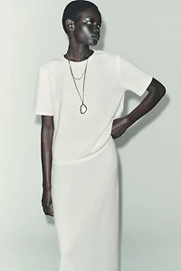 CUT-OUT KNIT MIDI SKIRT