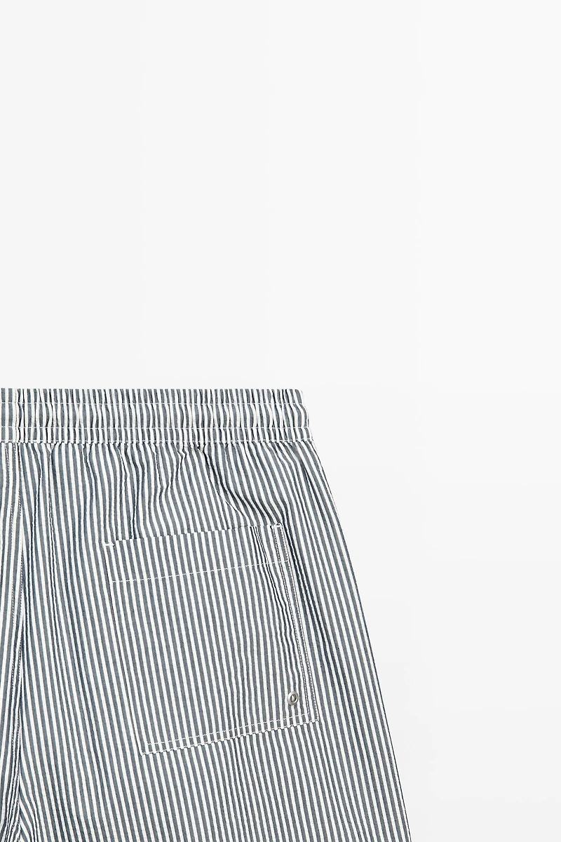 Swimming trunks with striped details