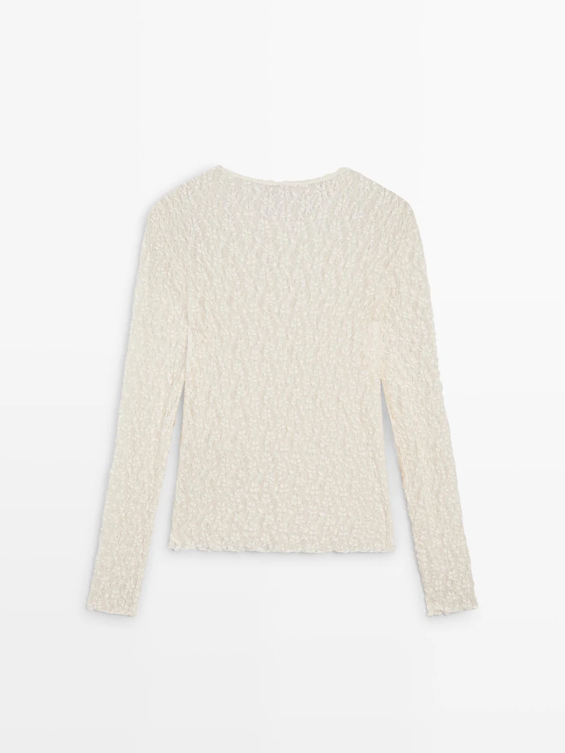 Openwork knit top with long sleeves and lace