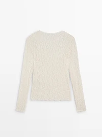 Openwork knit top with long sleeves and lace