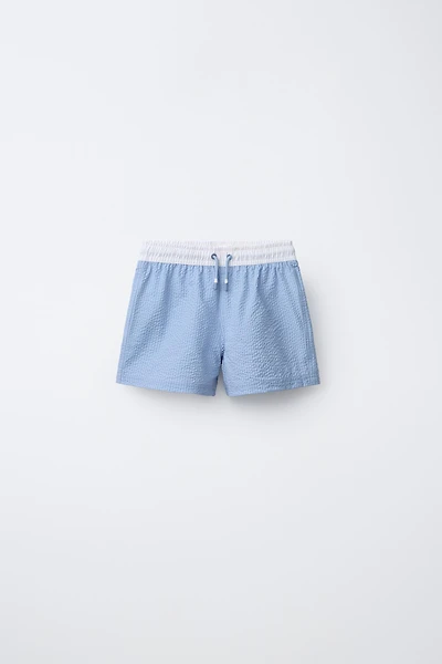 AGES 6-14 / LABEL SWIM SHORTS