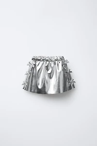 METALLIC SKIRT WITH BOWS