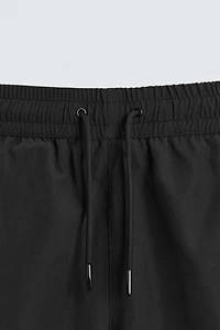 BASIC LONG SWIM TRUNKS