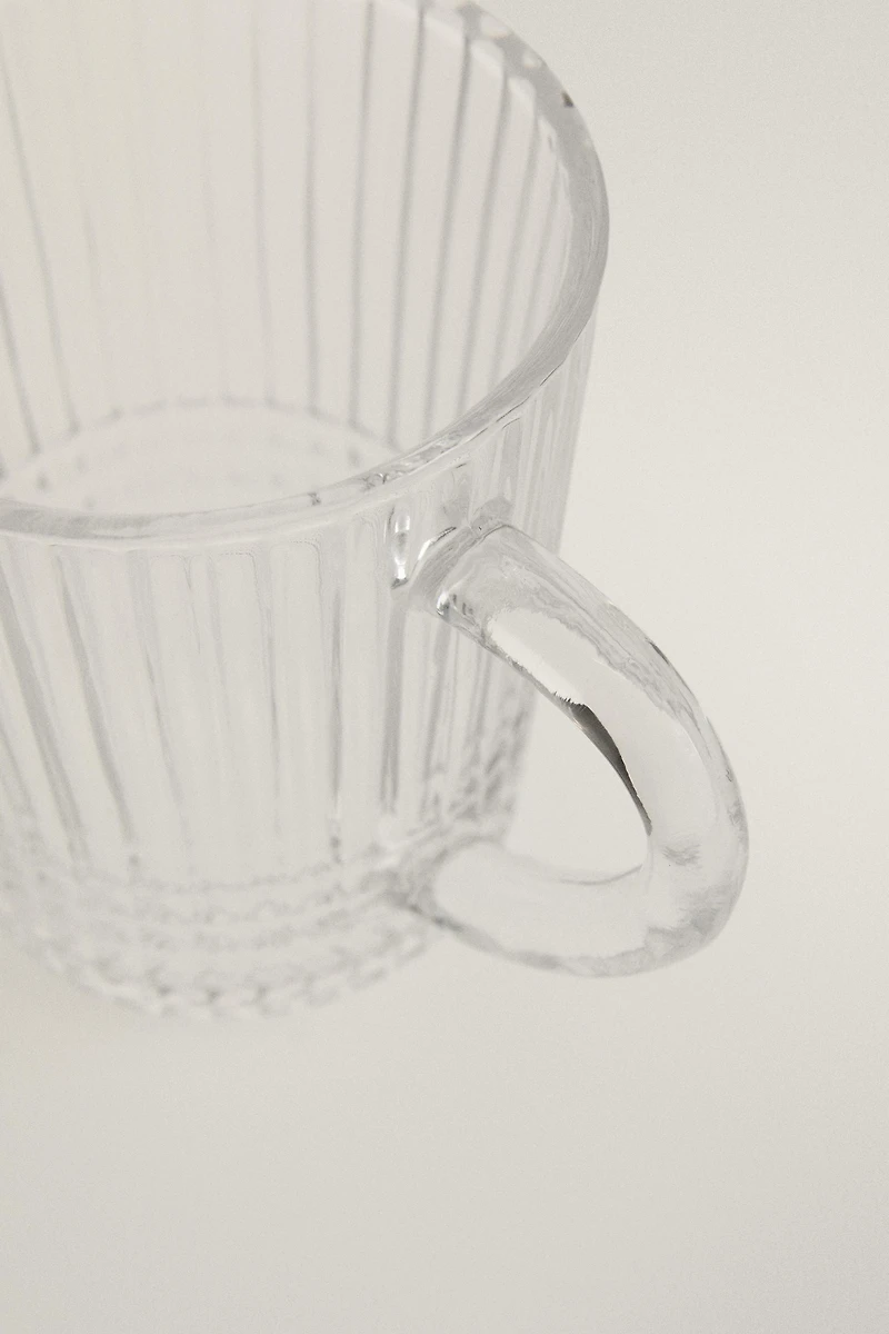 GLASS MUG WITH A RAISED GEOMETRIC DESIGN