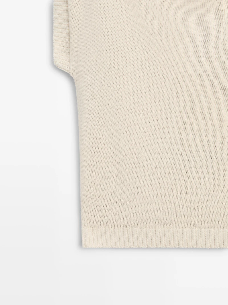 Knit sweater with low-cut back