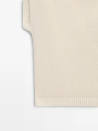 Knit sweater with low-cut back