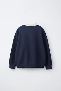 PULL POLO EN MAILLE VARSITY