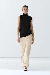 Asymmetric hem turtleneck top