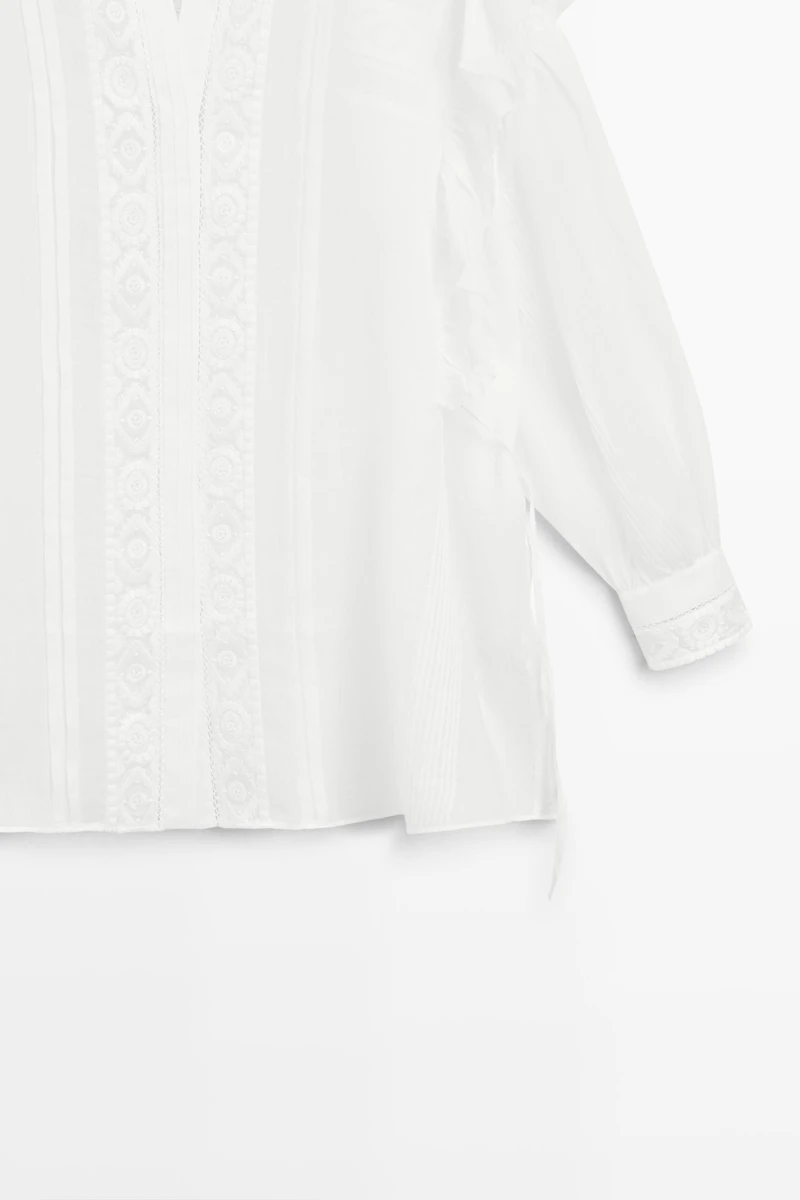 Stand collar blouse with embroidery and ruffles