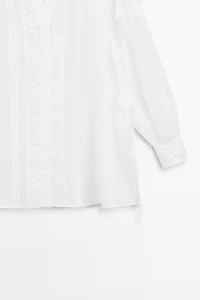 Stand collar blouse with embroidery and ruffles