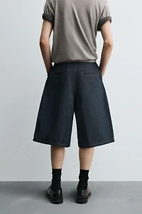 RELAXED FIT PLEATED DENIM SHORTS