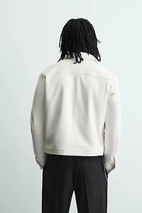 BLOUSON EN MATIÈRE SYNTHÉTIQUE BRILLANT
