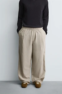 BALLOON FIT PLEATED PANTS